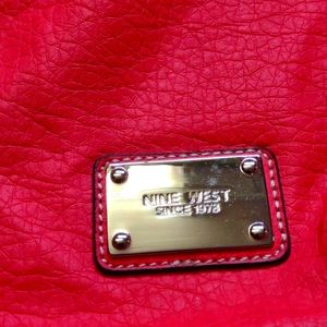 handbag, Nine west, papaya color very soft, zipper closure and one pocket inside